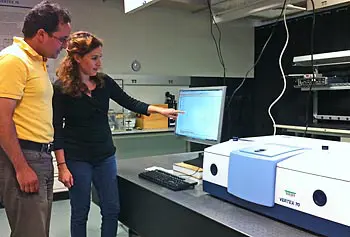 Assoc. Prof. Alkim Akyurtlu working with Ph.D. student Yassine Ait El Aoud in the newly renovated CEMOS laboratory. They are looking at reflectance data from one of their homogeneous negative refractive index metamaterials (based on a magnetic semiconductor) on the Vertex 70 FTIR spectrometer.