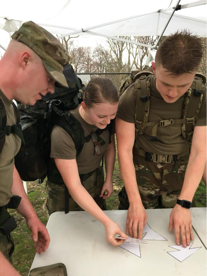 UML Cadets performing figuring out a puzzle during Arctic Challenge