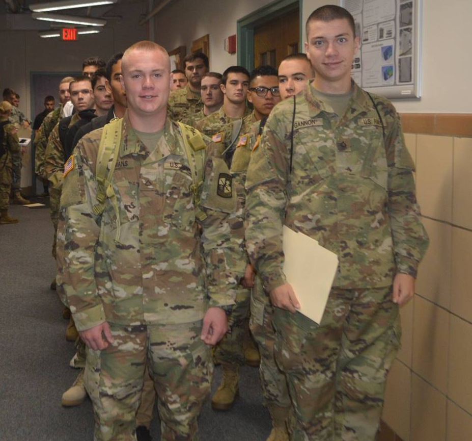 Cadets standing in a hallway in two lines