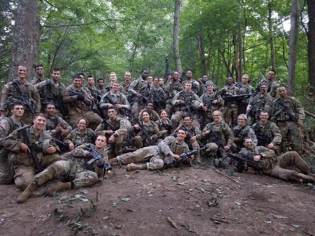 Cadets posing for a platoon photo in the woods after training