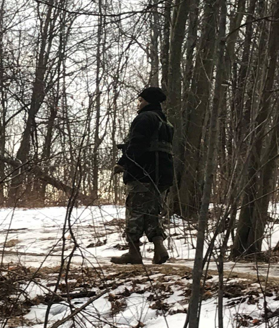Cadet in walking in the woods