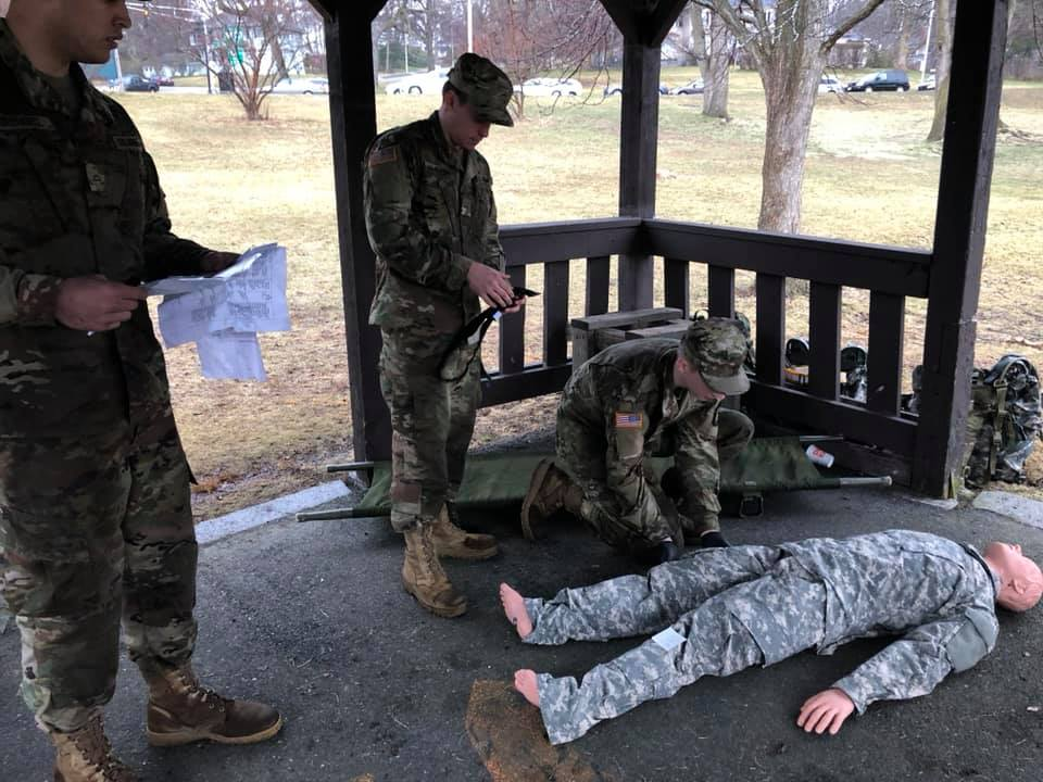 Cadets practicing life saving skills on a dummy