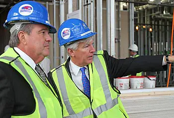 UMass President Robert Caret, left, with UMass Lowell Chancellor Marty Meehan during a tour of the Emerging Technologies and Innovation Center under construction.