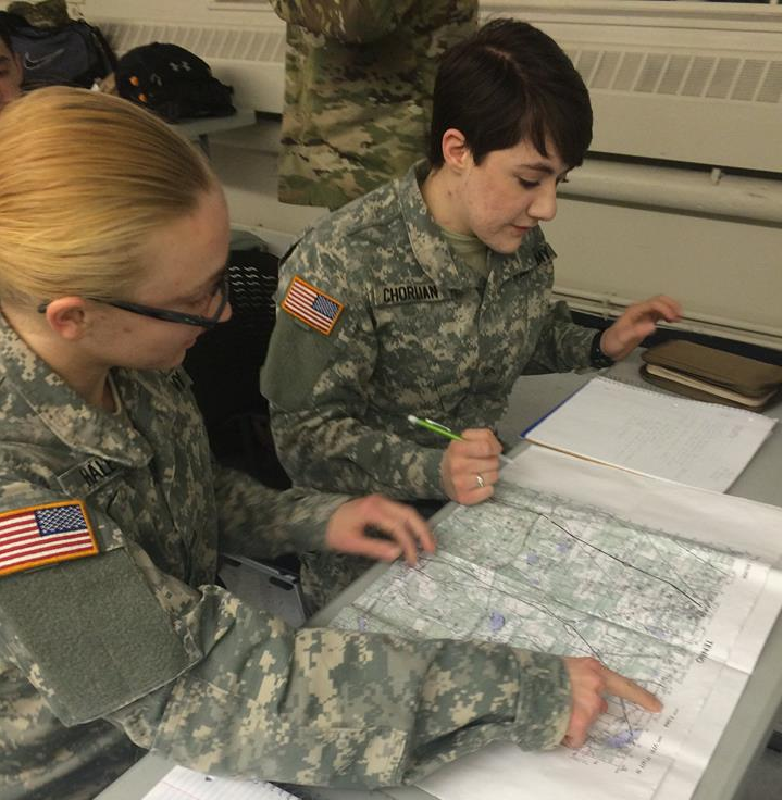 Cadets pointing on a military map