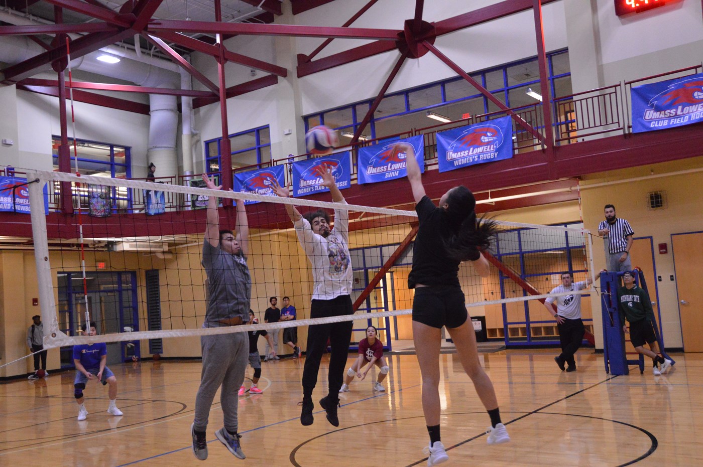 Students playing volleyball inside CRC.