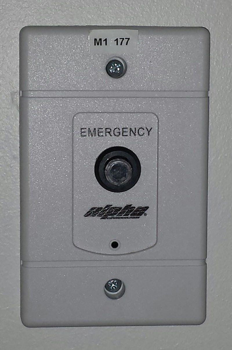 Residence Hall Emergency Button. The word Emergency is above the button and alpha below it. Also above: M1 177