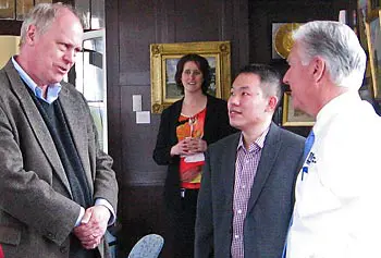 GENI Project Director Chip Elliott, left, talks to Chancellor Marty Meehan and Assoc. Prof. Yan Luo during a meeting at Allen House on South Campus on April 10. Looking on is Marcie Byrd of the IT Department.