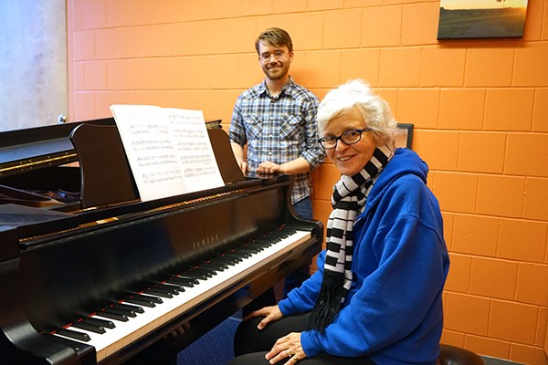 Piano student Dominique Haughton with her teacher, Jacob Hiser