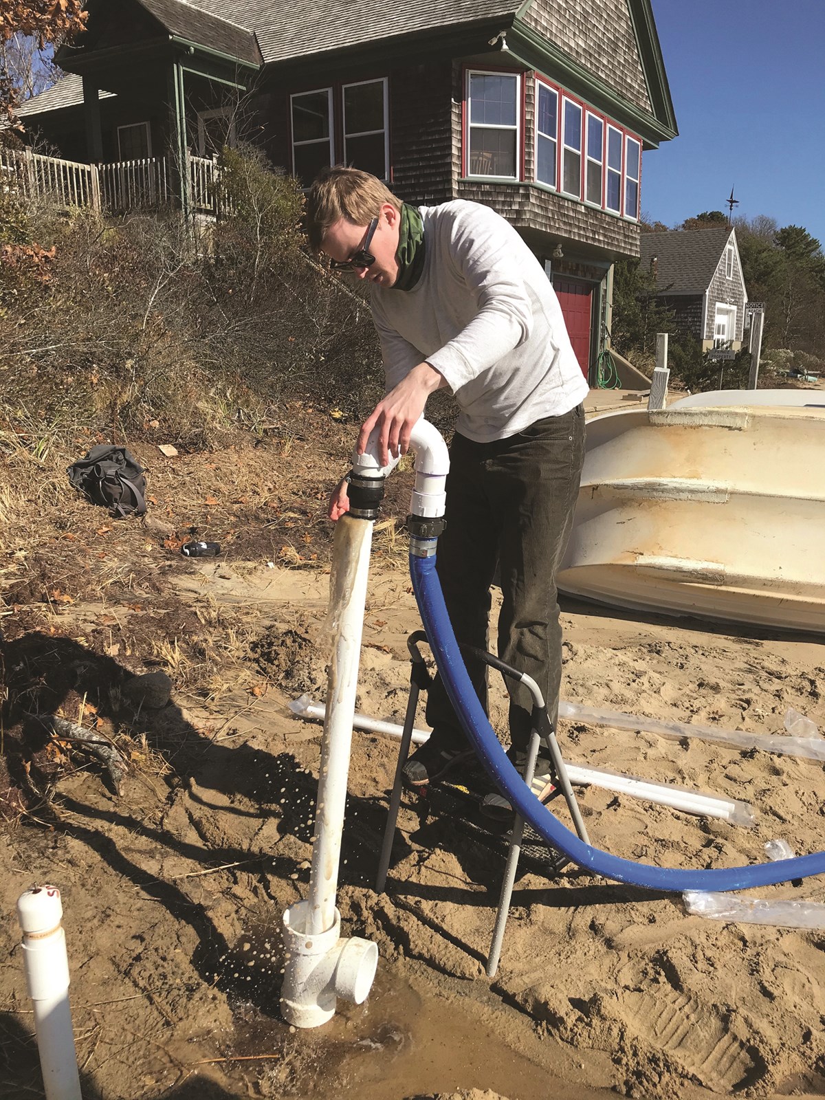 James Heiss digs a well at the beach