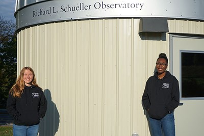 Physics majors Michele Woodland, left, and Shanice Kelly work at the new Schueller Astronomical Observatory.