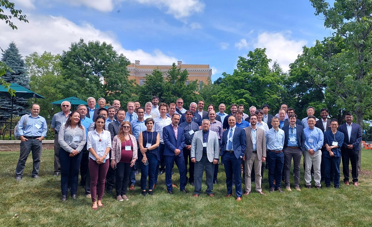 WindSTAR Industry Advisory Board Members and Faculty in front of the Lydon Library Lawn, with trees and Southwick Hall behind.