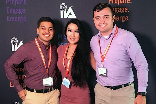 Students Sam Patel, Caroline Burgess and Shaymus Dunn pose together at the Internal Audit Student Exchange conference 