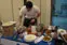 Graduate students Thomas Sniezek, Timothy Duffy and Jason Skeldon put the finishing touches on their winning meal in the third annual campus Iron Chef competition.