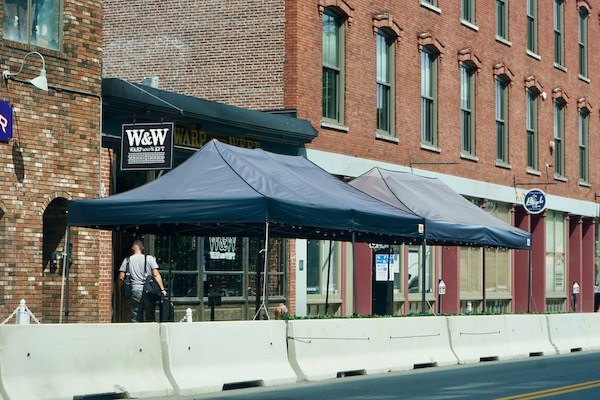 The outdoor seating area in front of the Warp and Weft restaurant