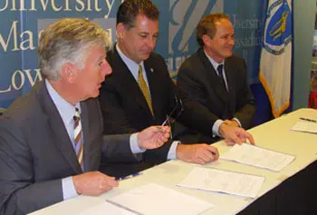 Chancellor Meehan, Sheriff Peter Koutoujian and Prof. James Byrne sign partnership agreement for research.