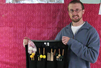 Matt Soares, a sound recording major and percussionist, received a donated stick bag from National Music to replace materials lost in the fire.