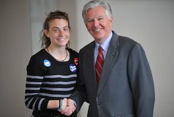 Chancellor Marty Meehan congratulates student Megan Lewis for spearheading the Ex-Smokers Hall of Fame project that aims to encourage people to kick the habit.