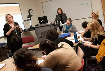 Laurie Hartwick, a high school teacher in Lawrence, talked to graduate education students in Assoc. Prof. Michaela Colombo's class about strategies for teaching English language learners.