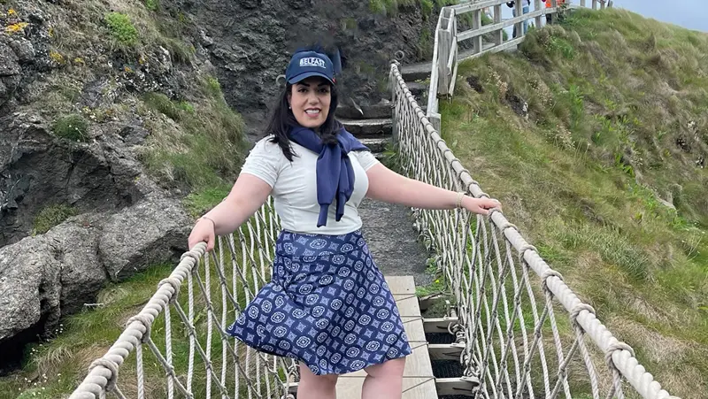 Parisa Raad stands on the Carrick-a-Rede Rope Bridge in Northern Ireland as part of a study abroad trip.