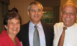 Welcoming Prof. Yoram Meital, center, are Prof. Paula Rayman, director of the new Center for Middle East Peace, and Provost Ahmed Abdelal.