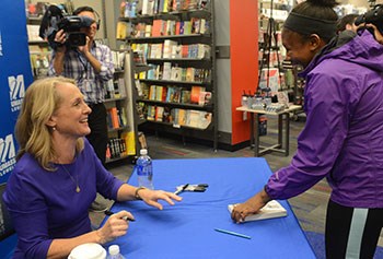 Piper Kerman signs her book at UMass Lowell's River Hawk Shop/Photo by Tory Germann