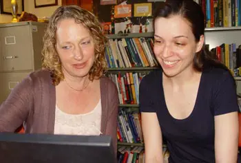 Jenifer Whitten-Woodring, left, assistant professor of political science, researches the role of press freedom in society with the help of&nbsp;Mikhaila Schaefer, a junior majoring in economics.