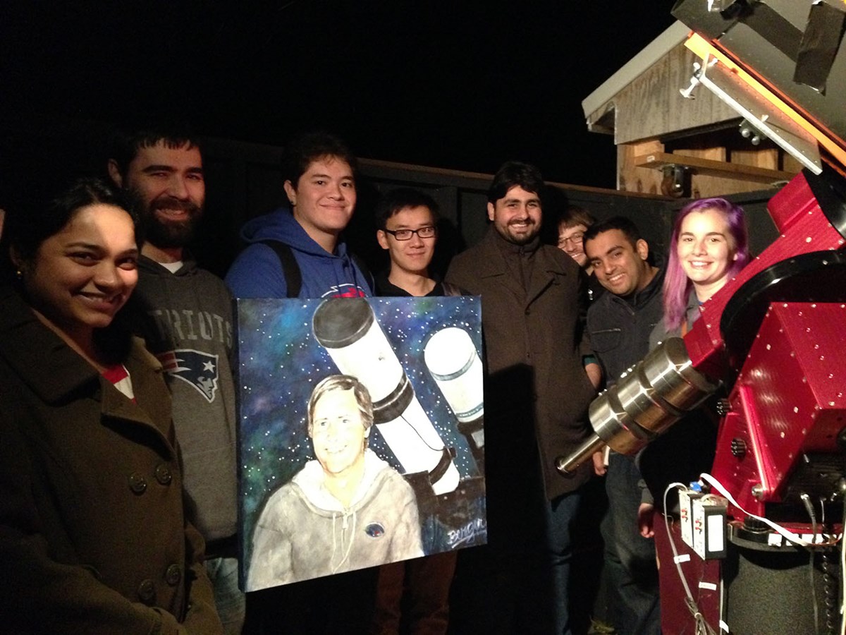 UMass Lowell students at the Schueller observatory (in its original site) holding a portrait of Richard Schueller (painted by a local artist and friend).