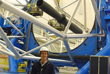 Silas Laycock in front of the 8-meter Gemini North telescope on the summit of Mauna Kea in Hawaii.