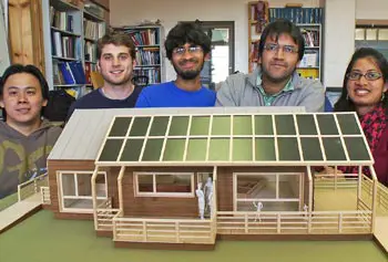 From left, UMass Lowell students Kemmeng Peng, Matthew Polese, Raam Perumal, Apurav Jain and Srilakshmi Kurmana pose with a scale model of the energy-efficient 4D Home that Team Massachusetts is entering at this year's Solar Decathlon. The competition will be held from Sept. 23 to Oct. 2 at the National Mall&rsquo;s West Potomac Park in Washington, D.C.