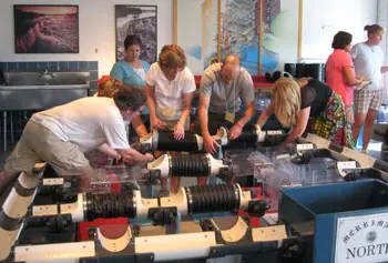 School teachers from around the country attempt to create a model canal system as part of a summer workshop at the Tsongas Industrial History Center.
