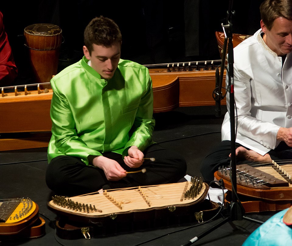 UMass Lowell Student playing instrument in World Music Cambodian Ensemble
