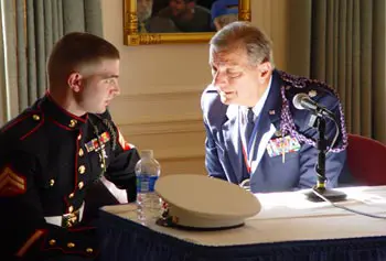 Veterans across generations have much in common. Current student, USMC Corp. Nicholas Lanteri, talks with by USAF Lt. Col. Peter Maravelias (retired), 1971 graduate of Lowell Technological Institute with a bachelor&rsquo;s degree in mathematics, before a veterans panel discussion.