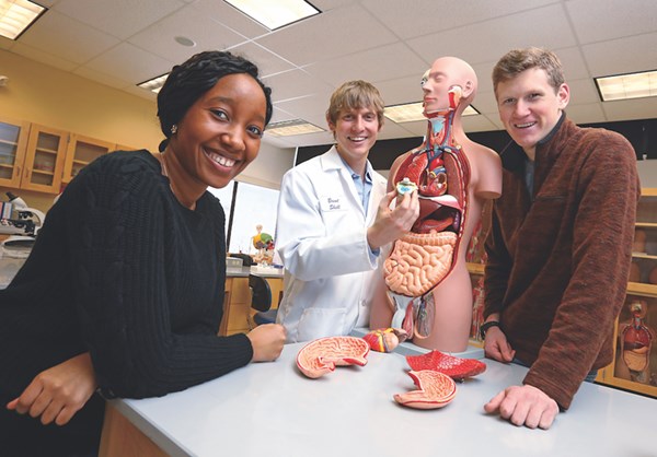 Asst. Teaching Professor Brent Shell (center) with students in the renovated anatomy and physiology lab