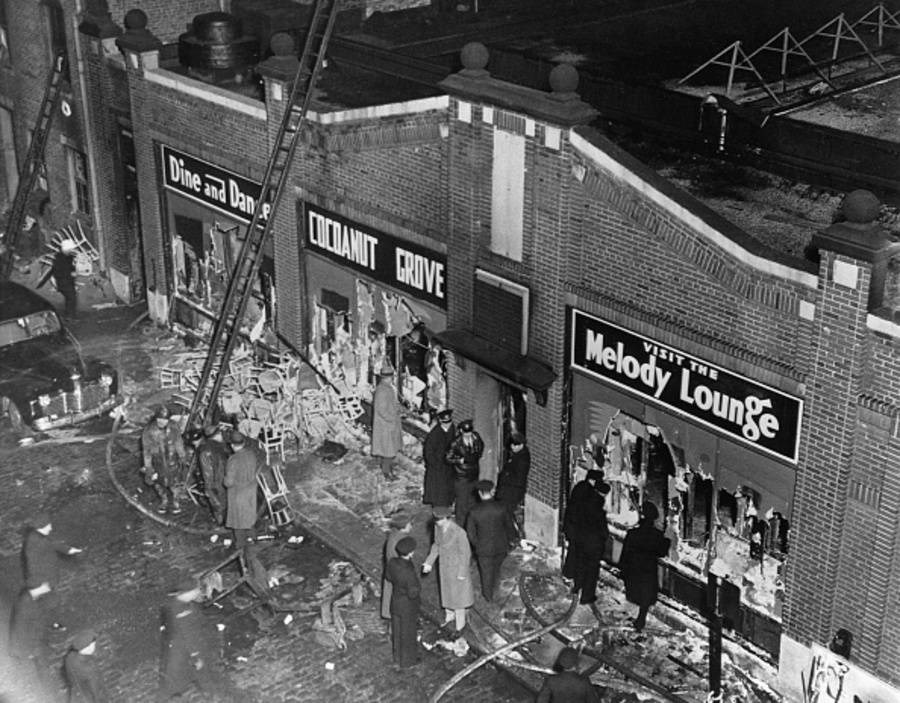Aerial photo of Nightclub remains after a destructive fire. The facade reads: Dine and Dance, Cocoanut Grove, Visit the Melody Lounge.