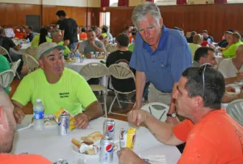 Hundreds of contracted tradespeople were treated to appreciation lunches on North and South campuses recently. Here, workers line up in Cumnock Hall, where the event was moved due to rain.