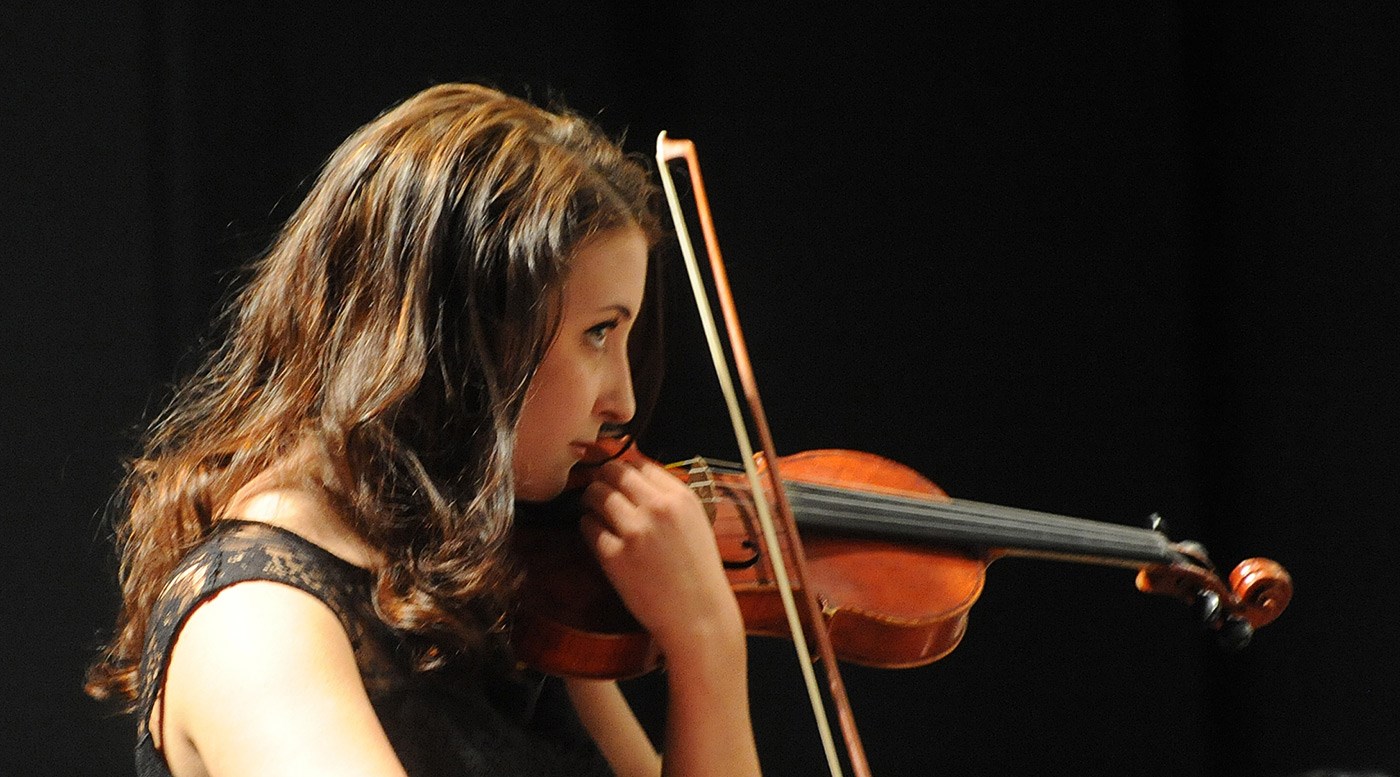 A violinist performs at the University Orchestra's "All You Need is Love!” Valentine's Day concert.