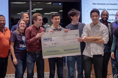 The winners, the UMass Lowell-based team RAMS, collect their prize after placing first in the recent Haverhill Hackathon.