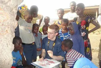 Nursing student Jason Hebert works with children in Ghana during semester break.