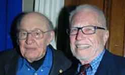 Local artist and honorary degree recipient Mico Kaufman, left, with Prof. Aldo Crugnola, plastics engineering, at the Commencement Eve Celebration.