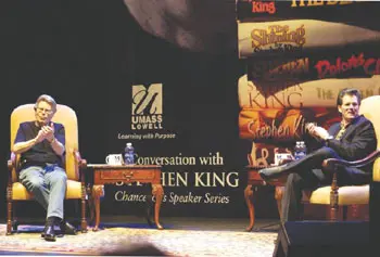 Best-selling horror-suspense writer Stephen King, left, joins fellow author Andre Dubus III on stage at the Tsongas Center at UMass Lowell Friday night for the inaugural event in UML's Chancellor's Speaker Series.