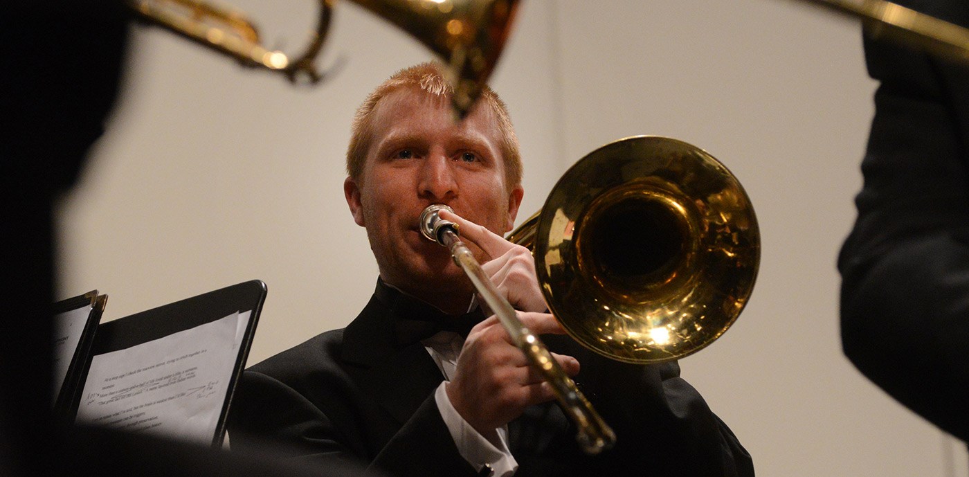 A trombone player performs at the University Orchestra's "All You Need is Love!” Valentine's Day concert.
