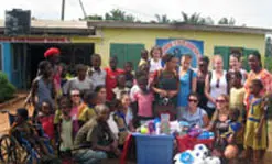 Nursing students make a donation at an orphanage in Ghana during a trip in January 2010.