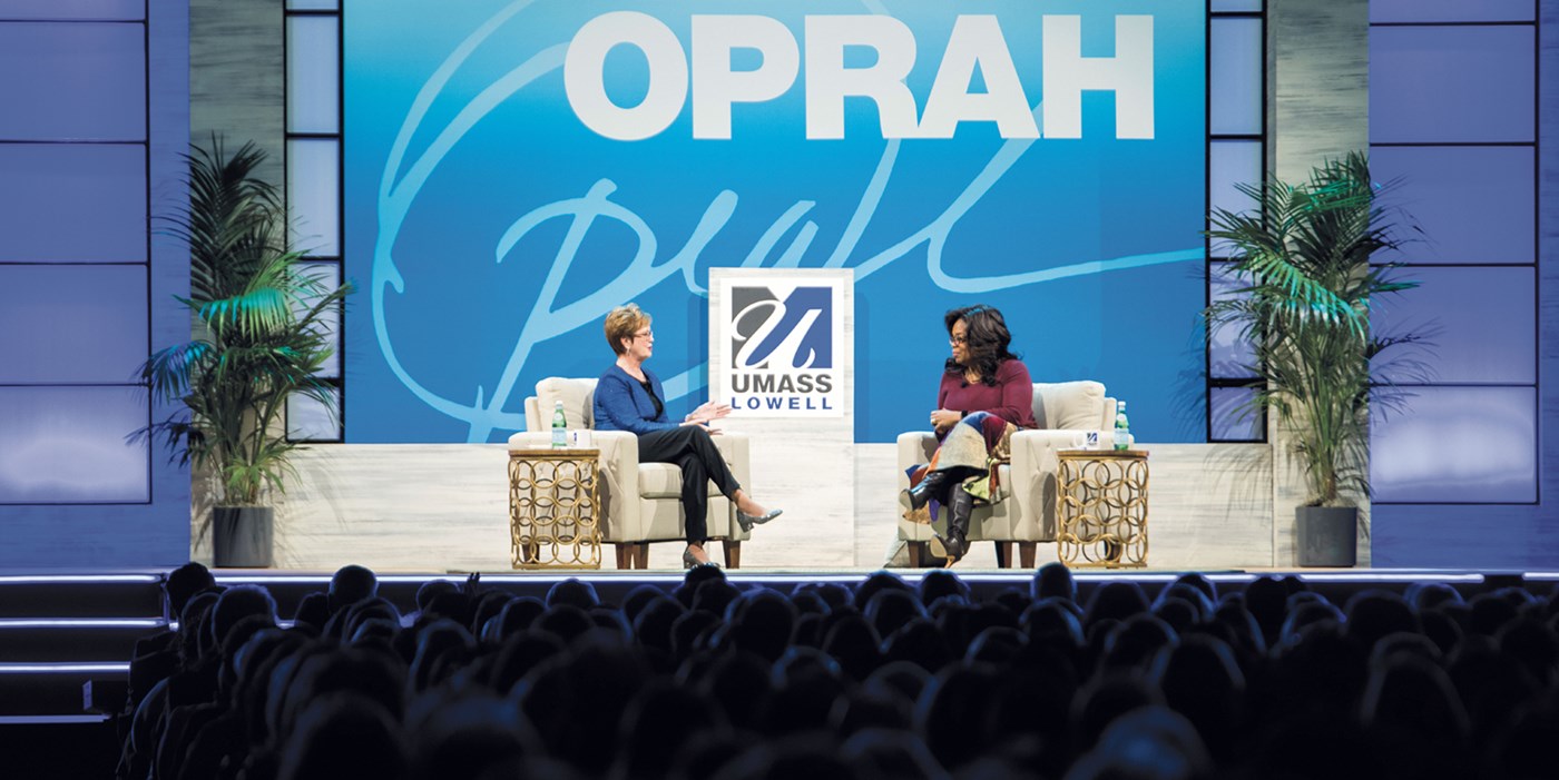 Oprah Winfrey onstage with Chancellor Jacquie Moloney at the Tsongas Center