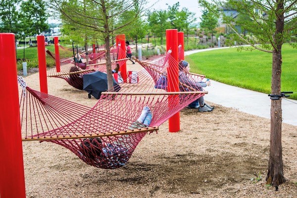 people lay in hammocks in a hammock garden