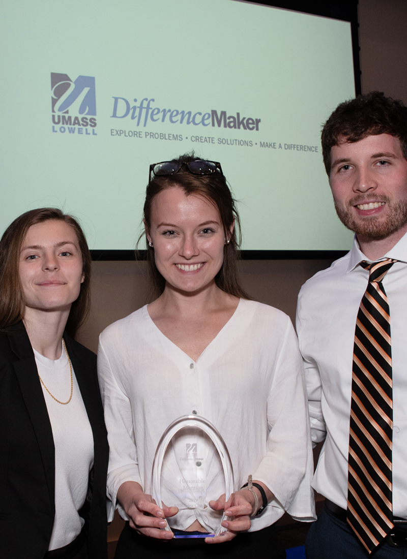 Tatiana Tompkins, Conrad Nelson and Jenna Olander hold their Honorable Mention award for Protected Pin at DifferenceMaker