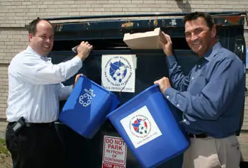 Director of environmental and emergency management Richard Lemoine, right, says increased recycling on campus reduces solid waste disposal&nbsp;costs. (Administrative services director Thomas Miliano is pictured at left). &nbsp;