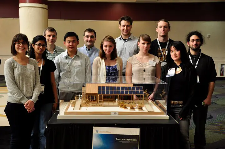 Members of Team Massachusetts from UMass Lowell, from left, Kemmeng Peng, a master's candidate in mechanical engineering; Matthew Polese, an undergraduate senior in management major; Raam Perumal, Apurav Jain and Srilakshmi Kurmana, all master's candidates in energy engineering, pose with a scale model of the energy-efficient house the team is entering at this year's Solar Decathlon. The competition is from Sept. 23 to Oct. 2 in Washington, D.C.&nbsp;
Photo Courtesy/Team Massachusetts