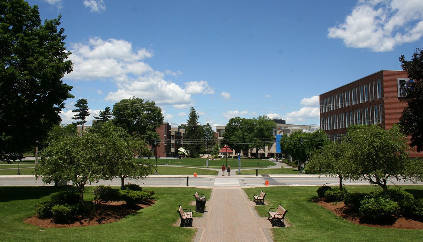 Wide shot of UML South Campus quad with gazebo in distance in center