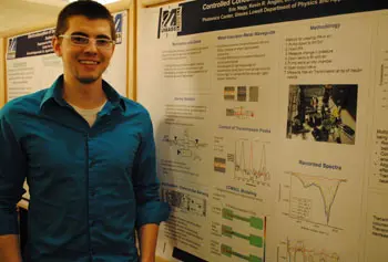 Physics student Eric Nagy shows his research on the detection of lower levels of chemical gases for military applications.