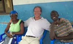 Public Affairs staff writer Geoffrey Douglas spends time with two new friends in Bagamoyo, Tanzania.